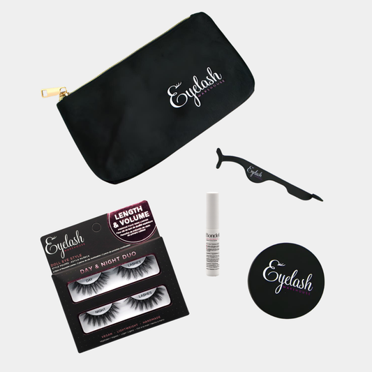 Eyelash products including a black pouch, box of lashes, and tools on a light grey background.