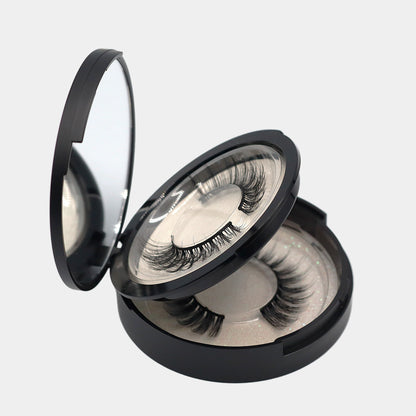 Side view of mirrored strip lash compact open showing both trays opened and two pairs of lashes