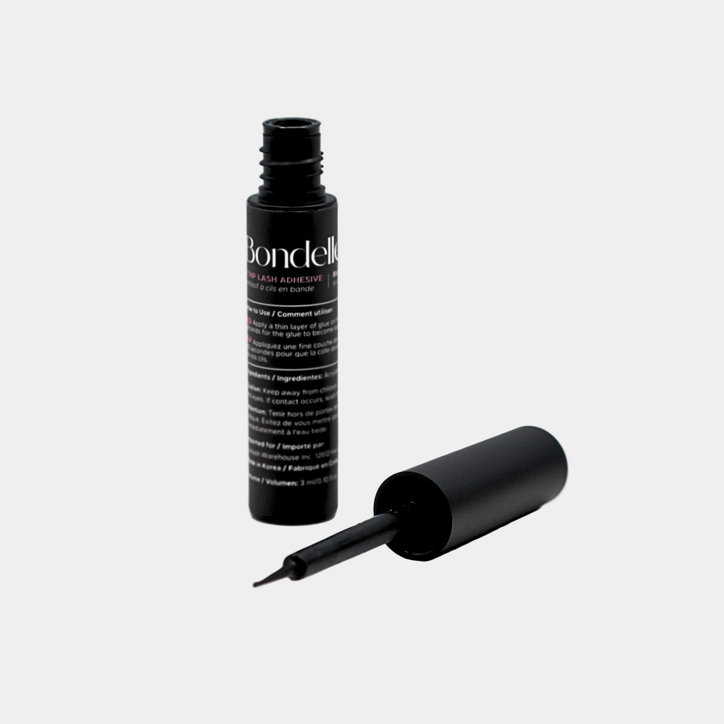 black strip lash adhesive open cap flat lay view