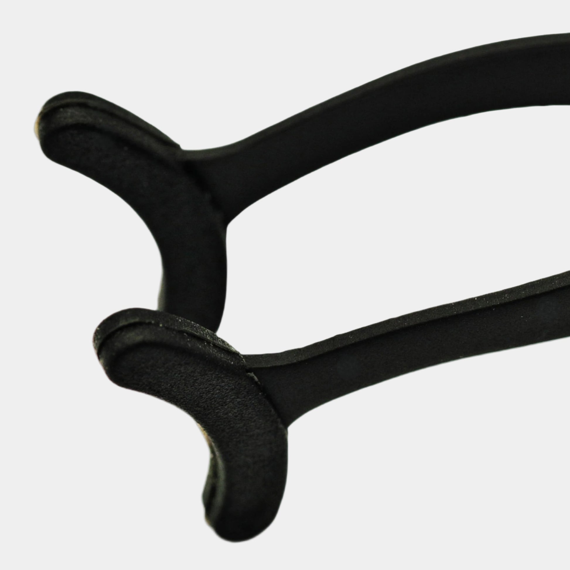 Strip lash applicator tool close up shot  showing ergonomic design and silicone tips