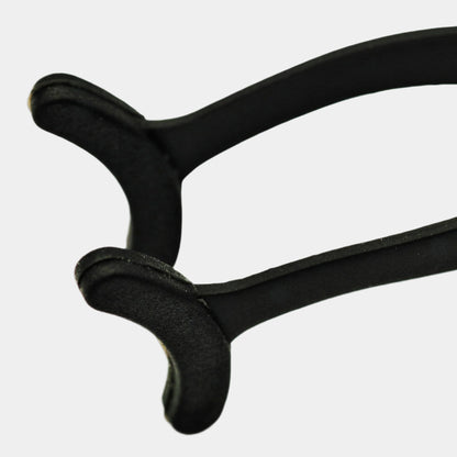 Strip lash applicator tool close up shot  showing ergonomic design and silicone tips